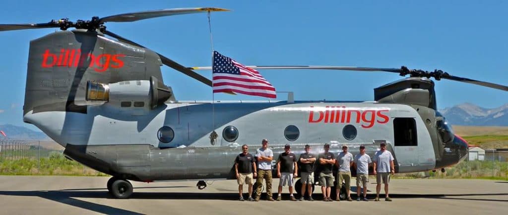 Crew of areial firefighters standing beside a CH-47