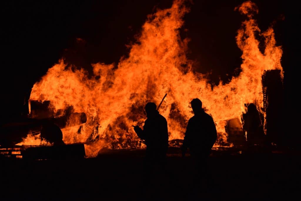 Firefighters surveying wildfire on the ground