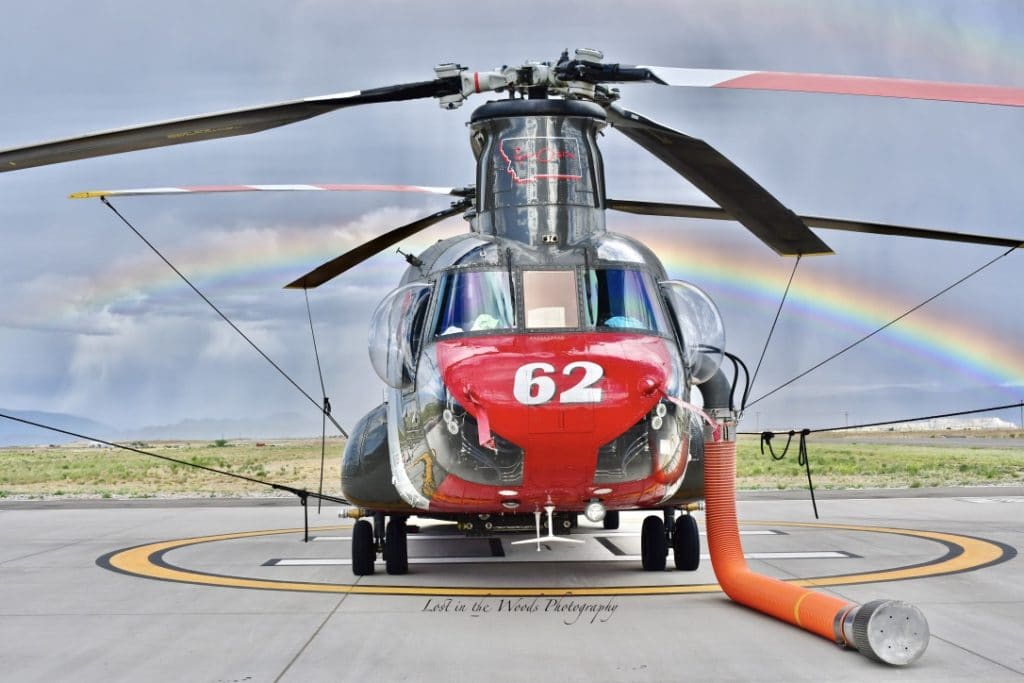 CH-47 Chinook Helicopter with fire fighting hose