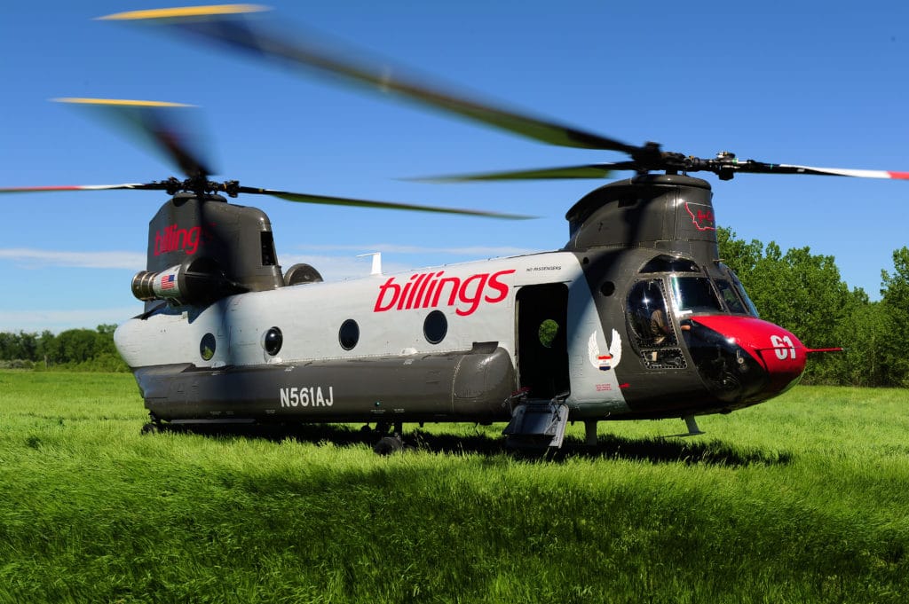 CH-47D Chinook Helicopter landing in a feild